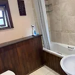 Oak Tree Nestled In The Hills Of The District And Yorkshire Dales *